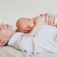 mather holding a baby in her arms