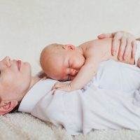 mather holding a baby in her arms